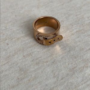 A rose gold ring.